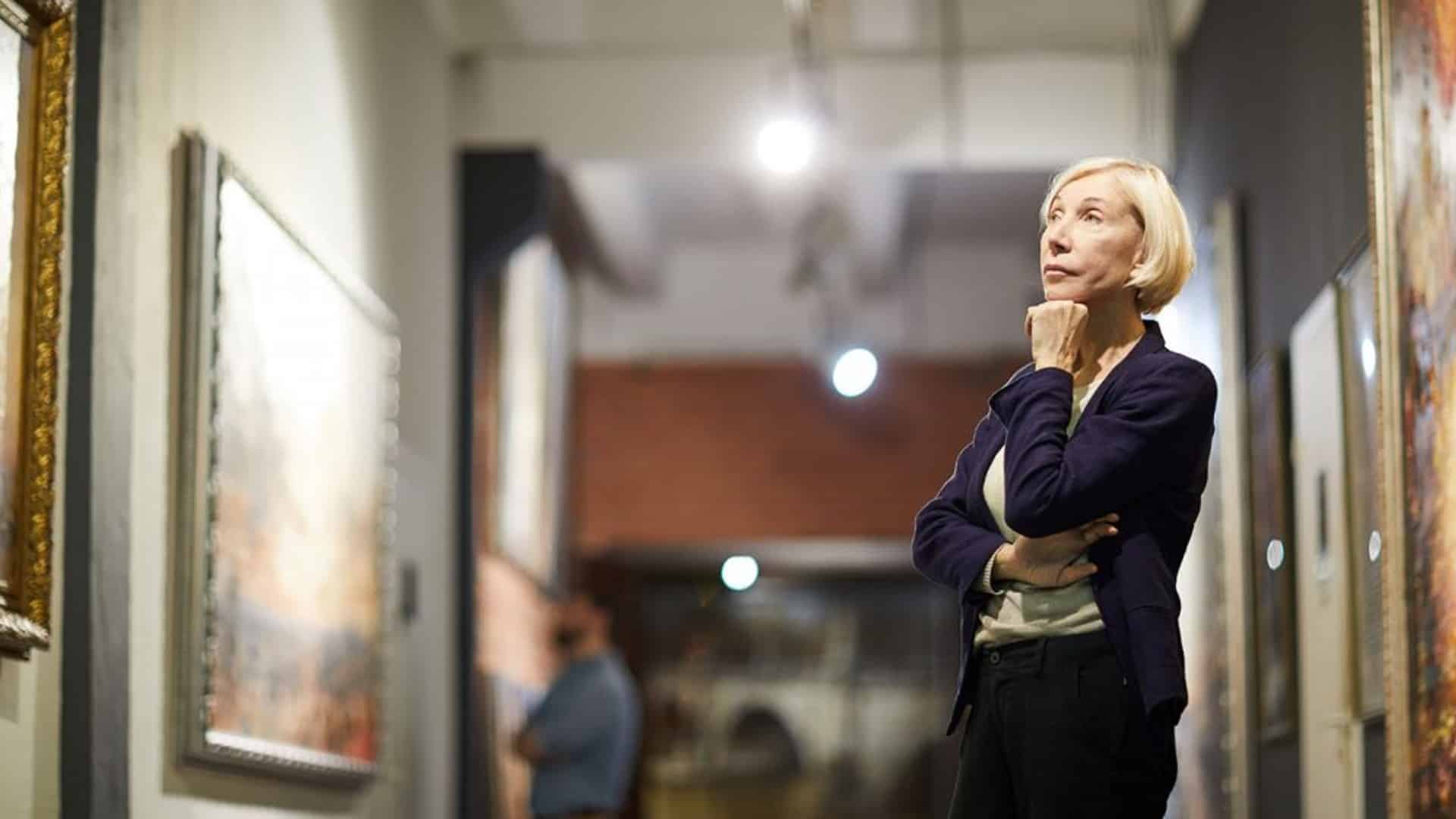 A woman admiring art in a museum